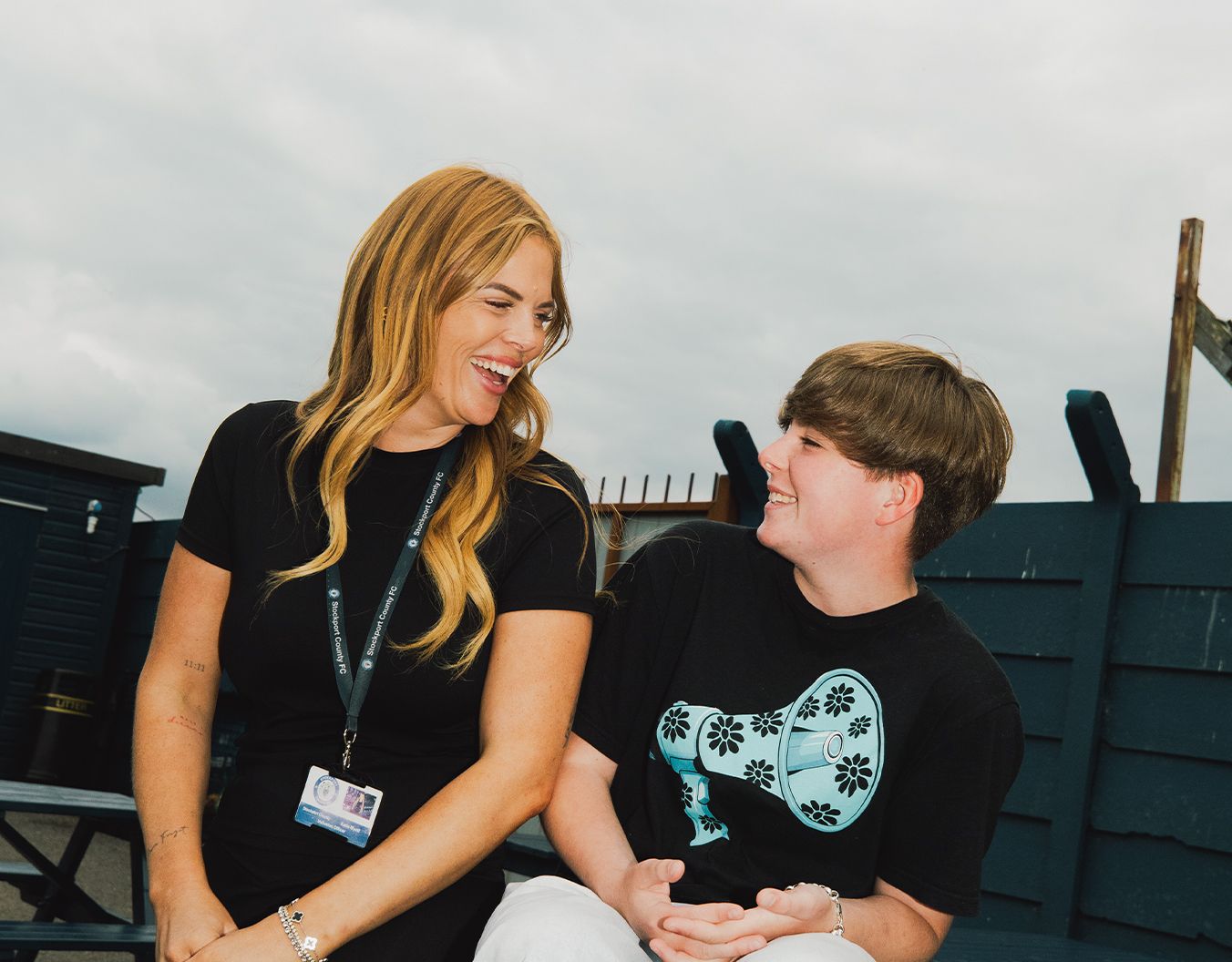 A woman and a child laughing together
