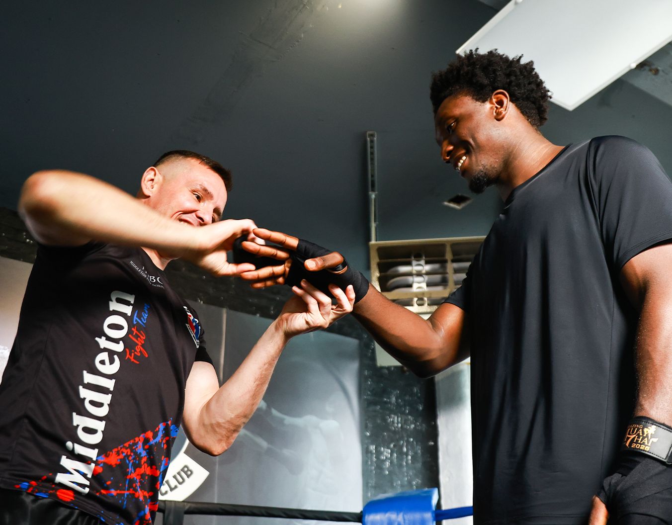 two young men wrapping up their hands