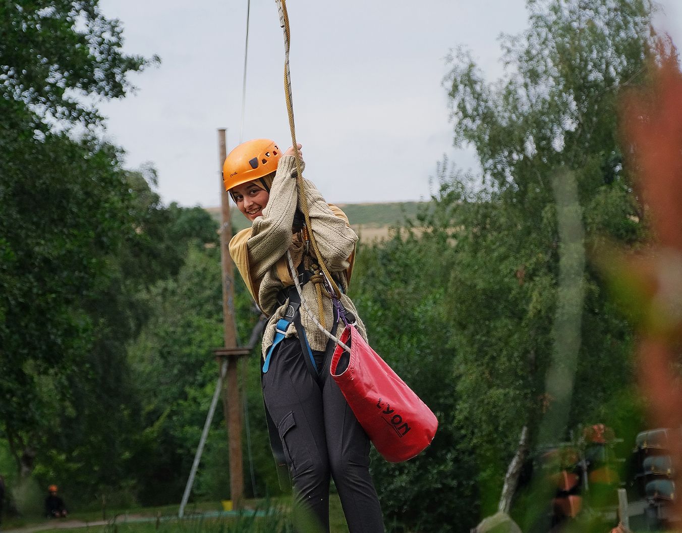 photo of a girl on a zip line